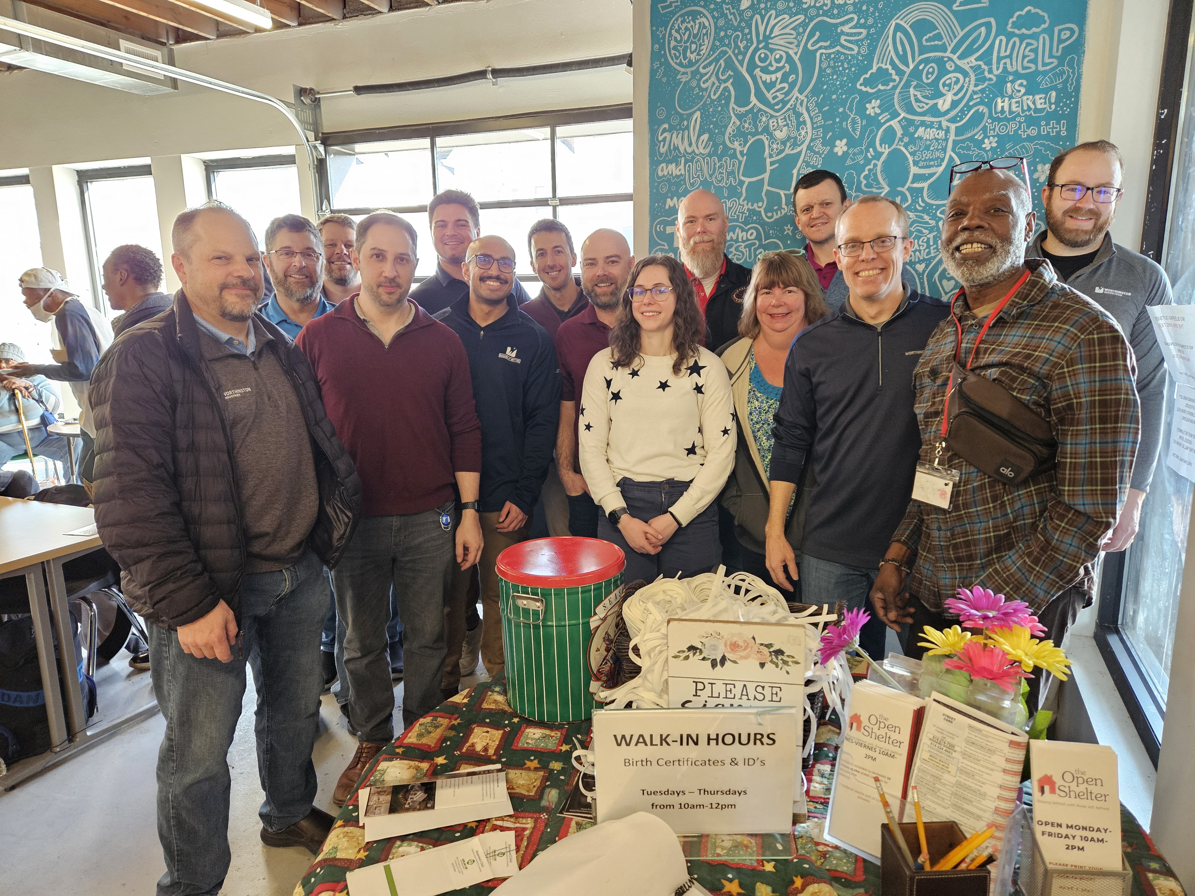 Worthington Steel employees volunteering at The Open Shelter, demonstrating the company's commitment to community service.
