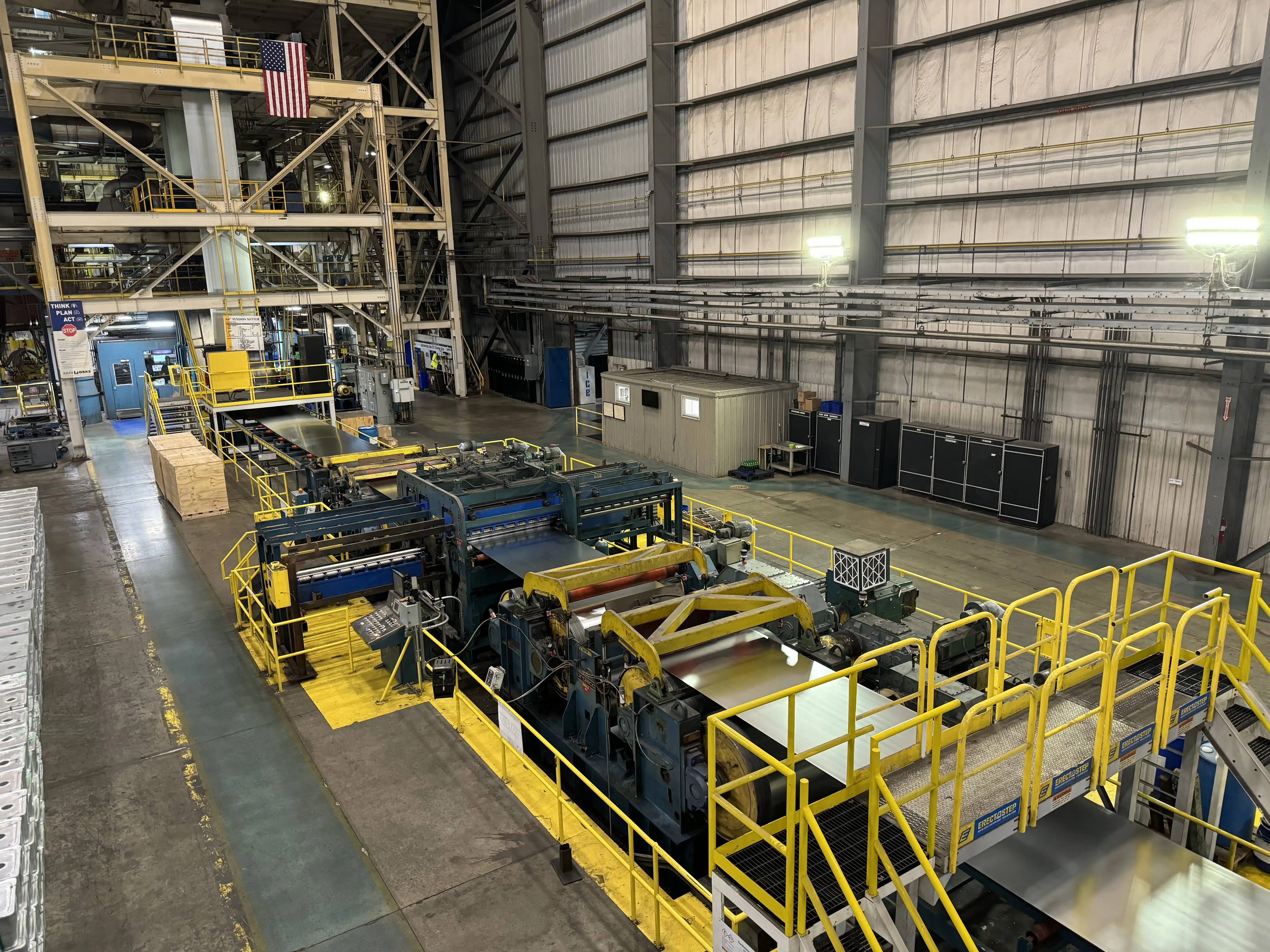 A line of equipment running a coil of steel to coat in zinc to create galvanized steel.
