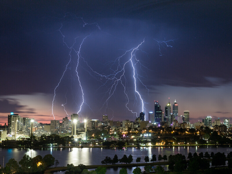 Lighting striking city at night.