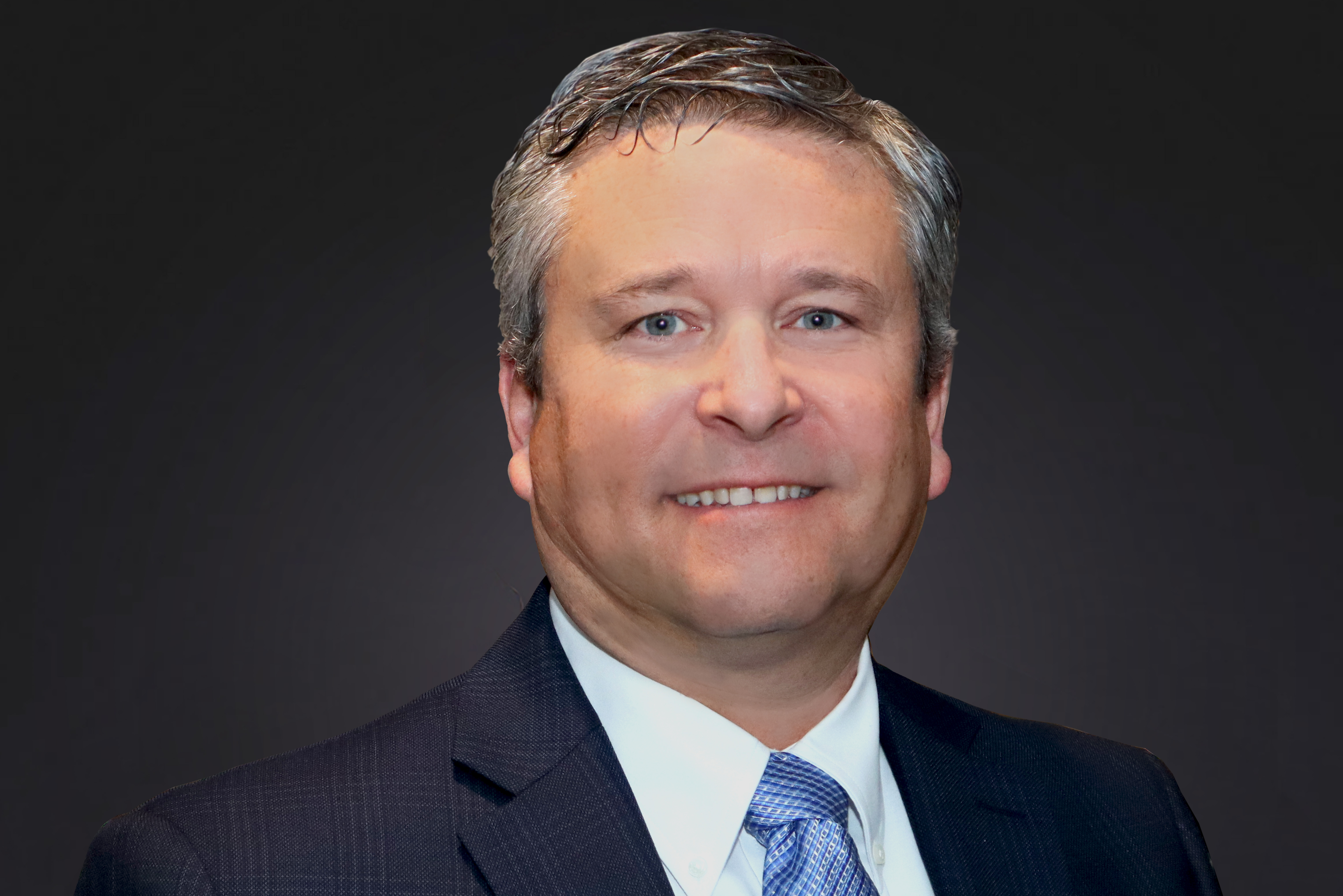 Headshot of Joe Heuer, vice president & general counsel for Worthington Steel.