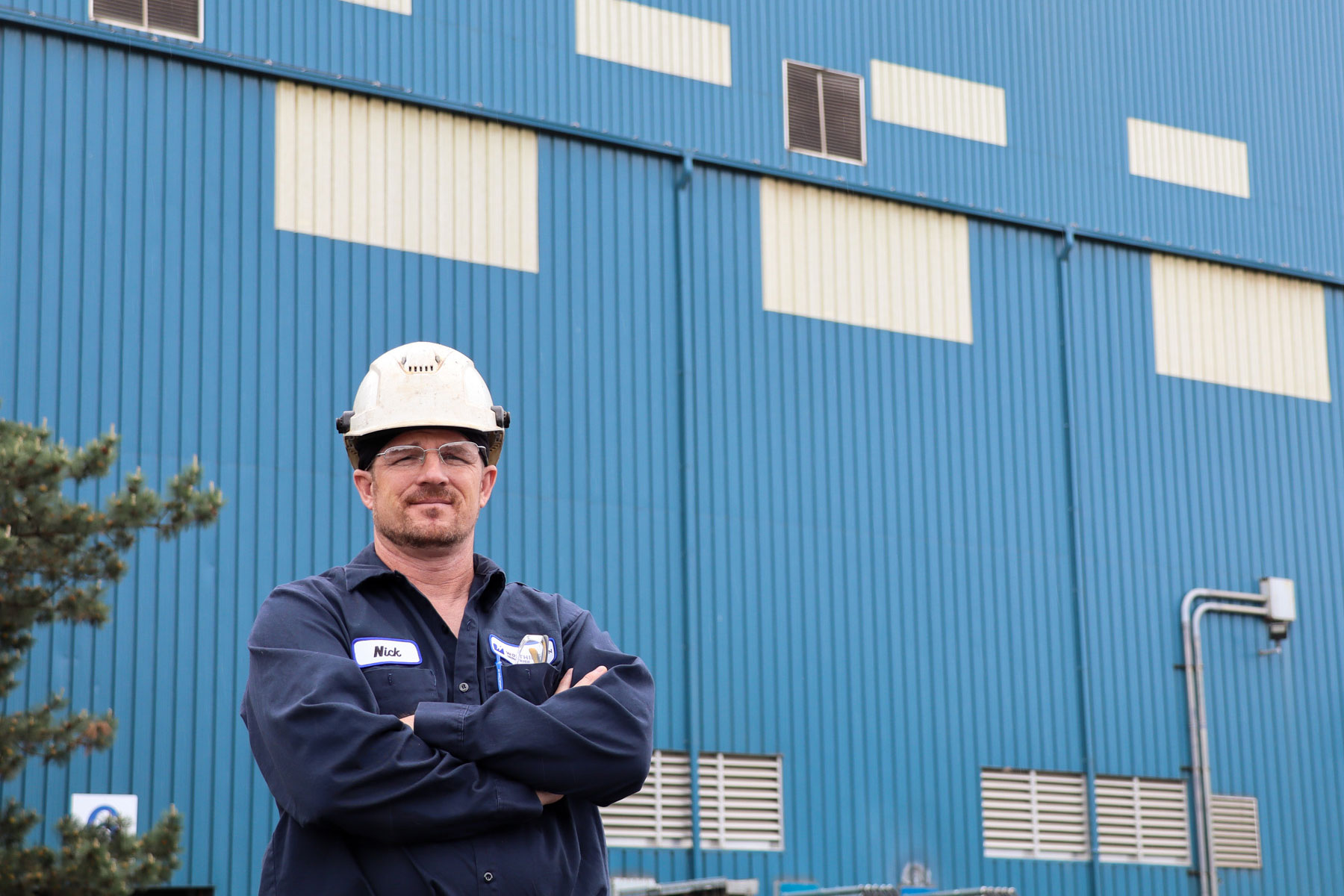 Worthington Steel employee standing in front of a steel processing facility in Delta, Ohio.