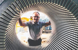 Man looking through motor during Tempel acquisition.