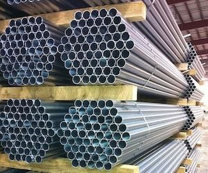 Stacks of roll form galvanized piping.