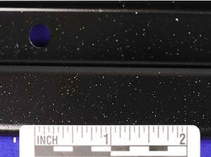 Picture of black e-coated steel with air bubbles.