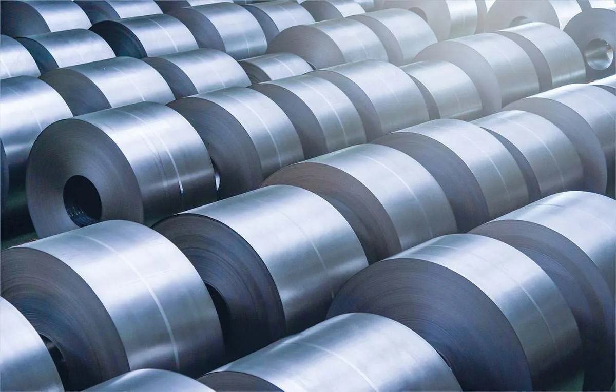 A collection of many galvanized steel coils, characterized by their reflective surface.