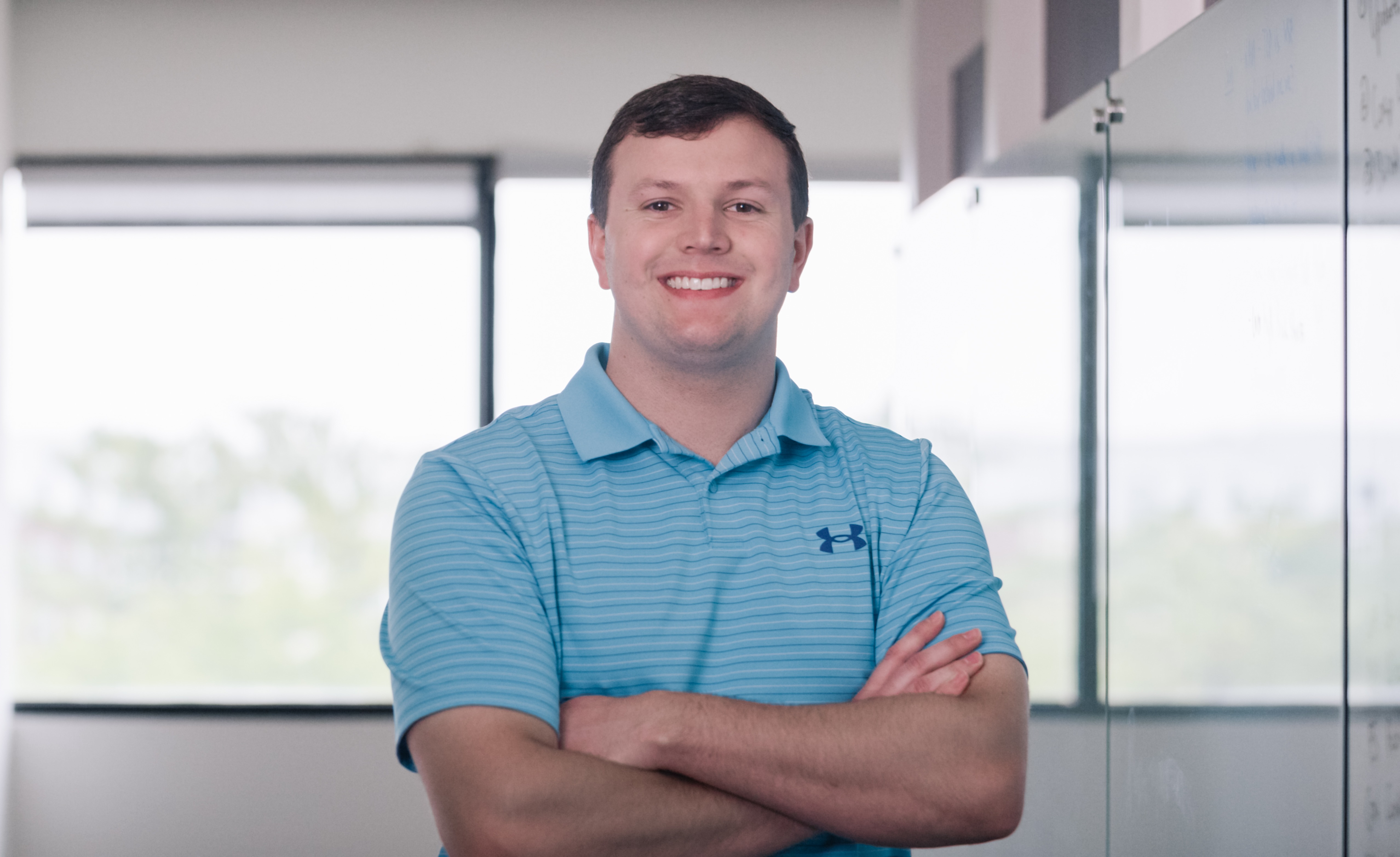 Worthington Steel team member smiling in a corporate office setting.